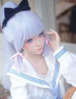 A doll with light blue hair and a sailor-style outfit.